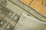 Folded corner of the Vintage Oushak runner, showing geometric pattern and secured side edge.