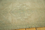 Faded celadon green and antique ivory pile texture on a vintage Turkish Oushak rug.