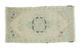 Hand knotted vintage Oushak rug runner featuring a stepped medallion in sand, celadon, and slate, 1'7