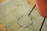 Vintage Oushak runner detail: even pile with circular design in sand, celadon, dark slate grey.
