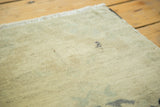 Vintage Oushak rug pile texture with even wear and subtle sand-celadon pattern.