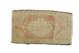 Vintage Turkish Oushak rug runner with a stepped medallion, burnt brick and beige tones.
