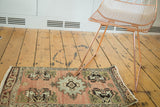 Vintage Oushak rug mat with central medallion, germinating planter corner design, in peach, grey, ivory.