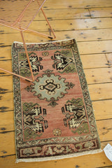 Expressive slate blue medallion and geometric planter design on the vintage Oushak rug.