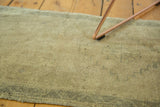 Vintage Oushak rug's hand knotted, irregular pile texture in sand, beige, oxidized green.