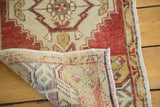 Corner detail of a hand-knotted vintage Turkish Oushak runner, showing weave and fringe.