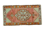 Vintage Oushak runner with faded cranberry, powder blue geometric stepped medallion. 1'8