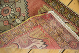 Hand-knotted reverse of Oushak rug, showing secured yellow selvage and white fringe.
