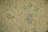 Distressed Oushak hand-knotted pile, showing soft sand, beige, and forest green.