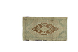 Vintage Oushak rug mat with elongated lozenge medallion, antique ivory, seafoam green, pale bronze.