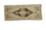 Vintage Oushak runner with rectilinear ram's horn medallion in beige, ivory, and dark bronze, 1'6