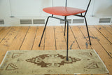 Vintage Oushak rug runner with rectilinear medallion and powerful rams horn motifs.