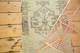 Charcoal geometric medallion and irregular village weave detail on the vintage Oushak runner.