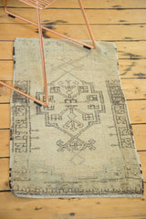 Vintage Oushak runner displaying irregular geometric patterns in charcoal on an ivory field.