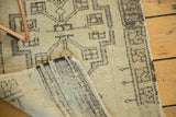 Irregular hand-knotted foundation texture of a vintage Oushak rug, showing its geometric pattern.