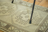 Minimalist geometric medallion on hand knotted Oushak rug with short textured pile.