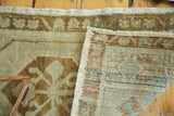 View of the vintage Oushak rug's hand-knotted foundation and secured woven edge.