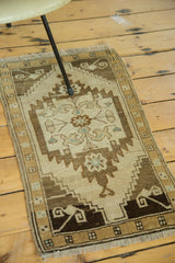 Vintage Oushak runner's serrated geometric medallion and scrolling rams horn design.