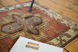 Detail of vintage Oushak rug, showing ivory fringe and irregular village geometric weave in raw copper.
