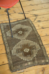 Geometric pattern with wooded brown and beige tones on a hand-knotted Oushak rug.