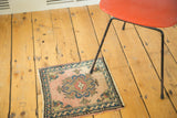 Vintage Turkish Oushak rug, apricot blush ground with deep blue meandering leaf border.