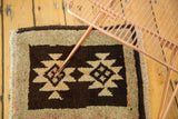 Hand knotted Oushak rug's plush pile, featuring charcoal and ivory serrated geometric pattern.