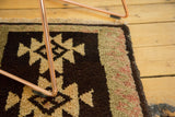 Plush vintage Oushak rug close-up with serrated geometric pattern, charcoal, ivory, seafoam.