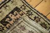 Plush pile and hand-knotted foundation with secured fringe of the vintage Oushak mat.
