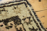 Vintage Oushak rug plush pile, with geometric ivory, pale blush, and charcoal pattern.