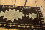 Textured thick pile of vintage Oushak rug, with charcoal, ivory, and sage geometric pattern.