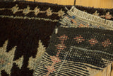 Vintage Oushak rug's hand-knotted foundation, fringed edge, and tribal geometric patterns.