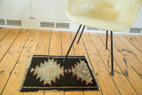 Thick plush pile with serrated pattern in charcoal, faded blush, and ivory on vintage Turkish Oushak.