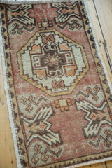 Vintage Oushak rug corner: distressed dusty blush, sand, bronze tones and planter motif.