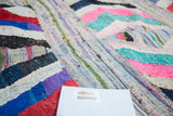 Vibrant textured weave of the vintage Moroccan rag rug with multi-colored cotton strips.