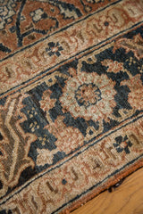 Antique Persian Tabriz rug's intricate Herati pattern in pale rust, ivory, and blue.