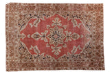 Distressed antique Persian Tabriz rug: starburst medallion, blossoming vines, pale rust salmon.