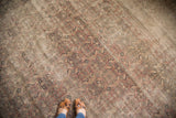 Patinaed vintage Kaisary rug featuring distressed Herati design in wooded earthen tones.