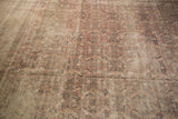Distressed vintage Kaisary carpet texture with faded Herati pattern and earthen patina.
