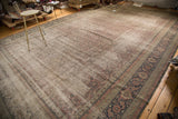Distressed Kaisary carpet's faded Herati pattern and dark border with turtle samovar motif.