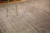 Threadbare texture, earthen tones, and soft patina of the distressed Kaisary carpet.