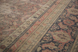 Distressed Kaisary carpet detail featuring Herati field and classic turtle/samovar border motifs with earthen patina.