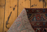 Hand-knotted foundation and distressed jewel rose, sapphire blue pile of the Lilihan rug.