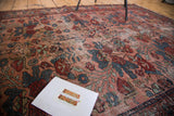 Distressed texture and floral bouquet motifs in jewel rose and blue on the Lilihan rug.