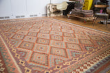 Hand-knotted Kilim carpet, geometric serrated diamond motif in rust orange, cinnabar, ivory.