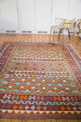 Detail of hand knotted tribal Kilim carpet with vibrant running channels of water motif.