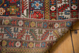 Hand-knotted foundation and vibrant geometric patterns of a Caucasus Shirvan rug.