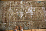 Distressed antique Malayer rug, its foundation showing through the moss green and slate blue field.