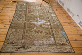 Distressed antique Malayer rug corner, Herati border, exposed foundation, moss green, brown, blue.