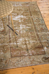 Distressed antique Malayer rug corner, showing foundation, Herati border, moss green and brown.