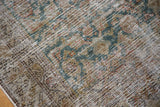 Intricate faded teal Herati motif with distressed antique Malayer texture.